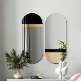 Black oval mirror with a...